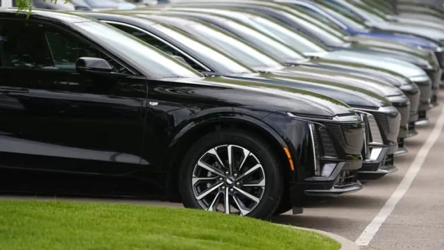 Vehicles sit in a row outside a dealership, June 2, 2024, in Lone Tree, Colo. Car dealerships across North America have faced a major disruption this week. CDK Global, a company that provides software for thousands of auto dealers in the U.S. and Canada, 